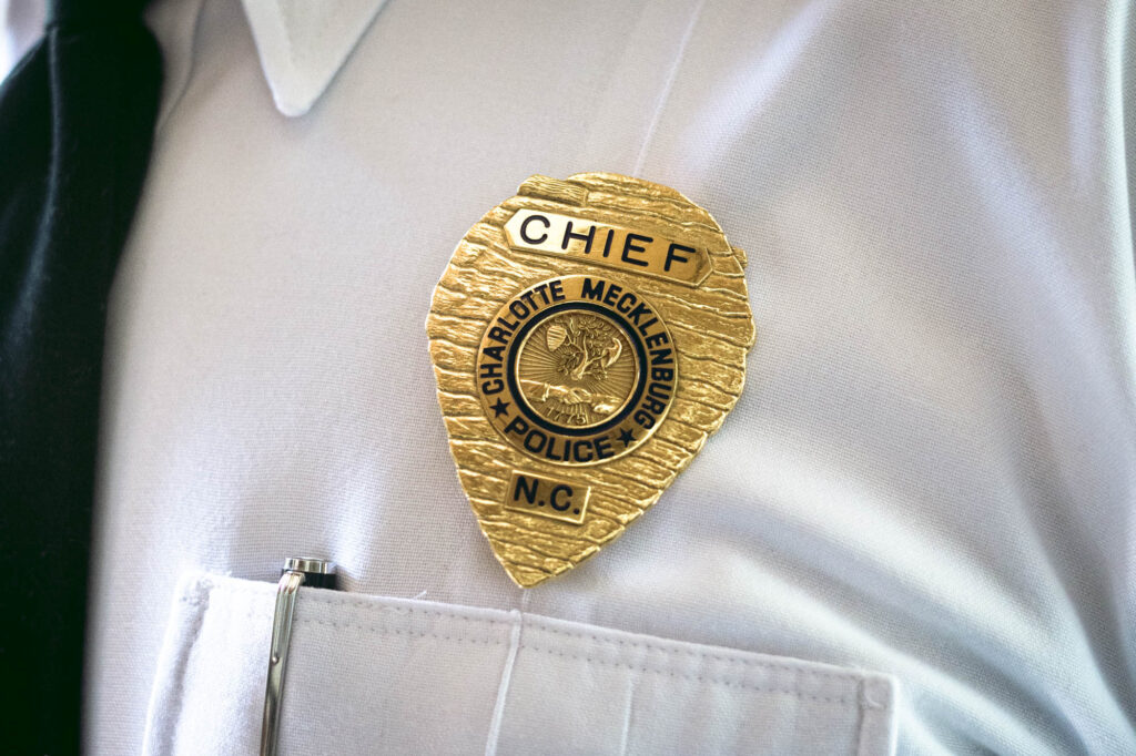 Johnny Jennings has worn the CMPD chief badge since July 2020. (Photo by Logan Cyrus)