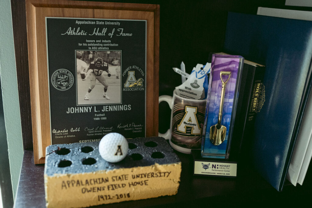 Office memorabilia in CMPD Chief Johnny Jennings' office shows his plaque for being inducted into Appalachian State's Athletic Hall of Fame