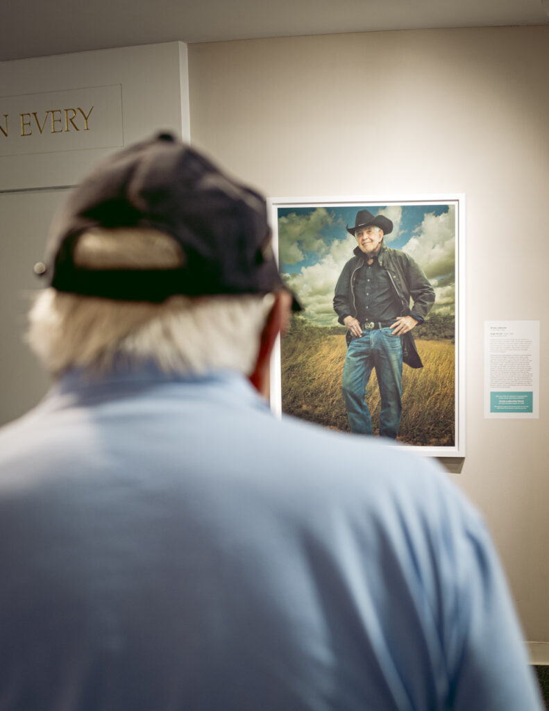 Former Bank of America CEO Hugh McColl looking at his Annie Leibovitz portrait at the Mint Museum in Charlotte in 2025. Photo by Logan Cyrus