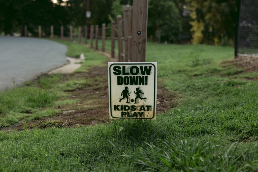 "Slow Down Kids at Play" sign