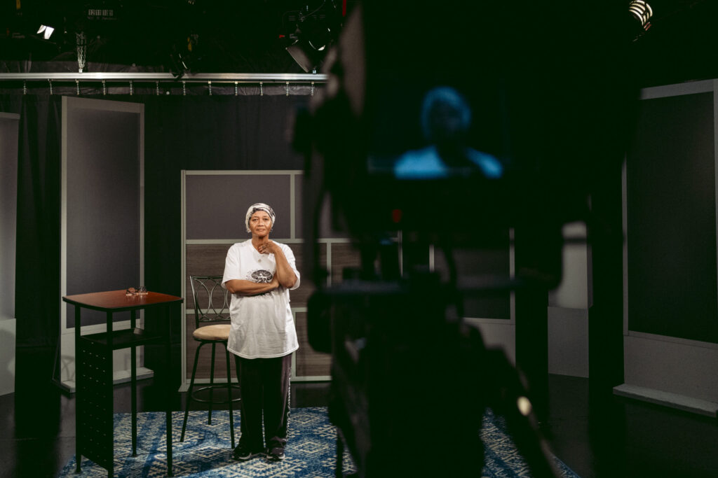 Shanita Poe stands on set as she decides what angles she wants for her show. Photo by Logan Cyrus