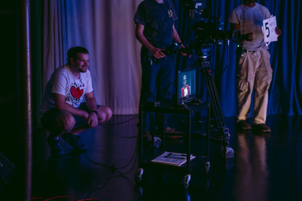 Intern Marco Falucci looks on during filming of Access 21’s self-produced show “CMPAC Spotlight.” Photo by Logan Cyrus