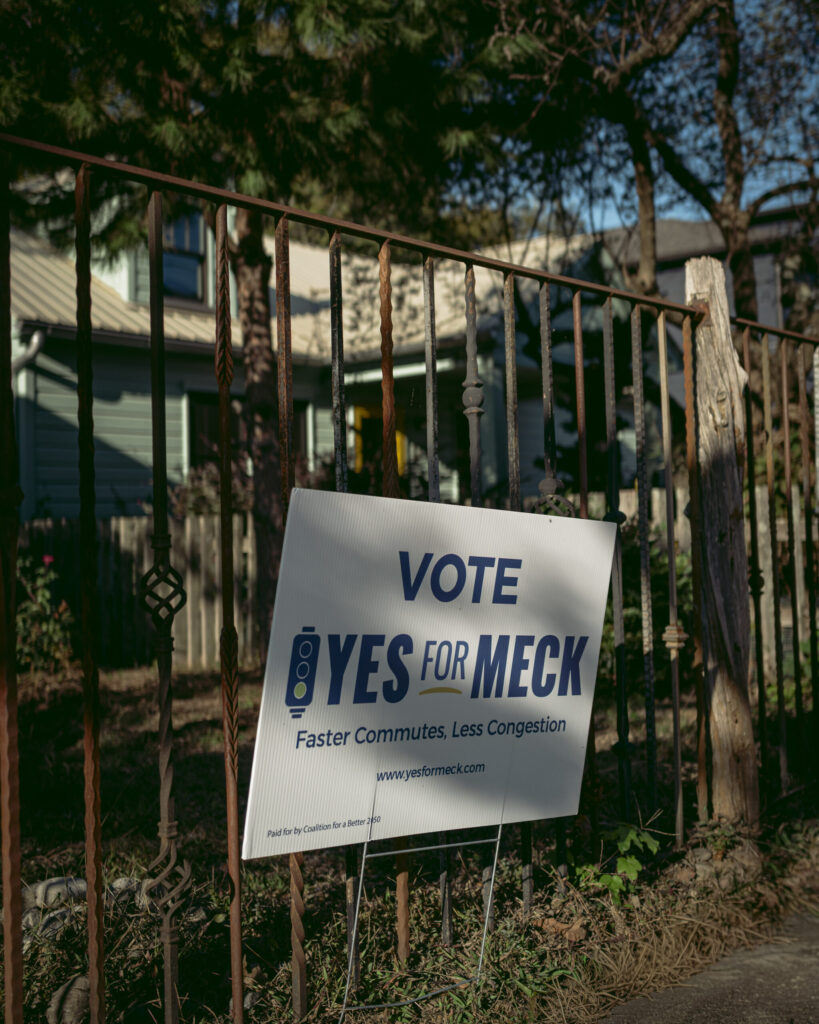 A "Yes for Meck" sign signaling support for the transportation plan in NoDa