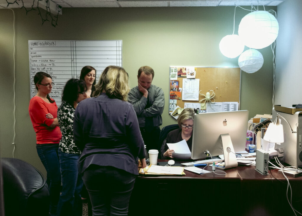 Looking over the final pages with design lead Jane Fields at Charlotte magazine