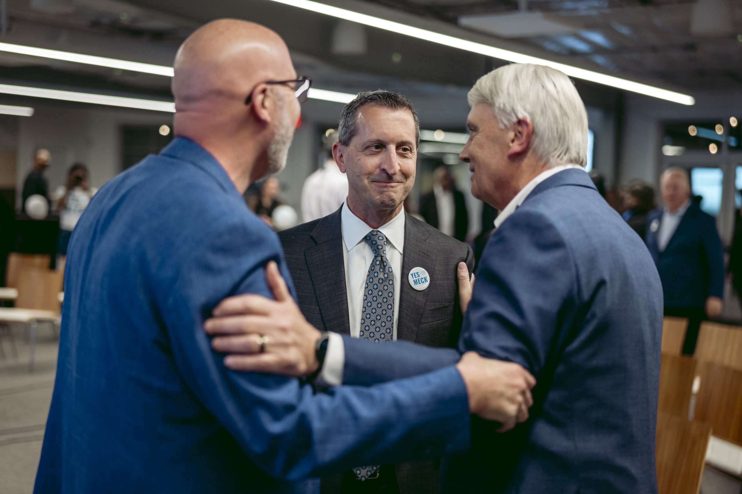 Charlotte Regional Business Alliance CEO Robert McCutcheon (center) with CBI Workplace Solutions CEO David Longo (left) and former state transportation board chair Ned Curran, celebrating the results of last night’s election. Photo by Logan Cyrus