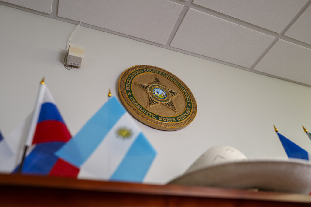 The Mecklenburg County Sheriff's seal above McFadden’s desk.