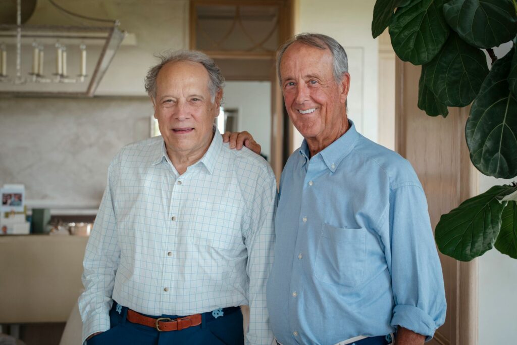 Nelson Schwab and Erskine Bowles, with Erskine's arm on Nelson's shoulder